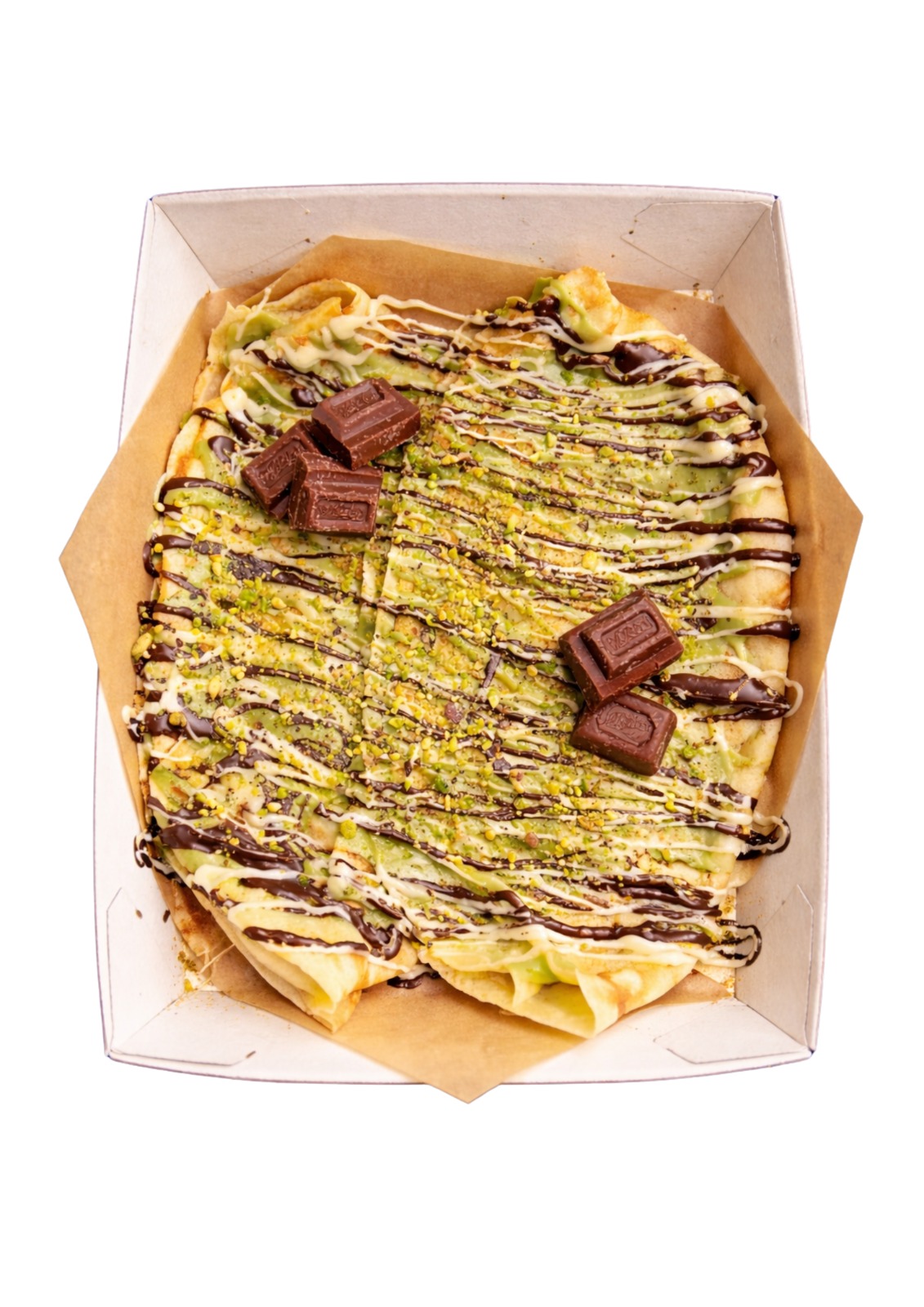 Pistachio crêpe drizzled with chocolate and topped with Whittaker's chunks