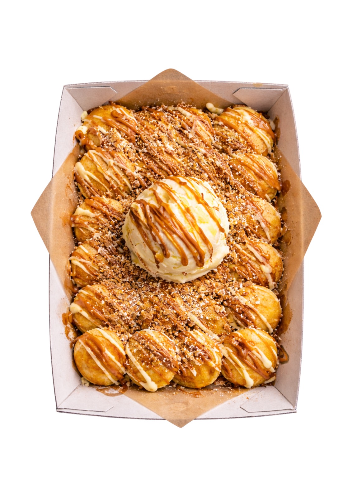 Mini Dutch pancakes topped with caramel sauce, crumble and a scoop of ice cream at Kiwi Dose Mount Eden